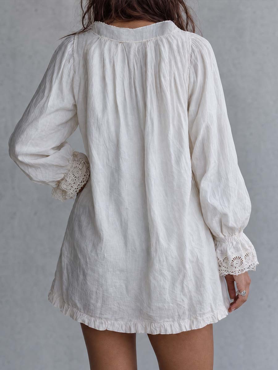 Vintage-style zip-up collar lace-trimmed white mini dress detail view
