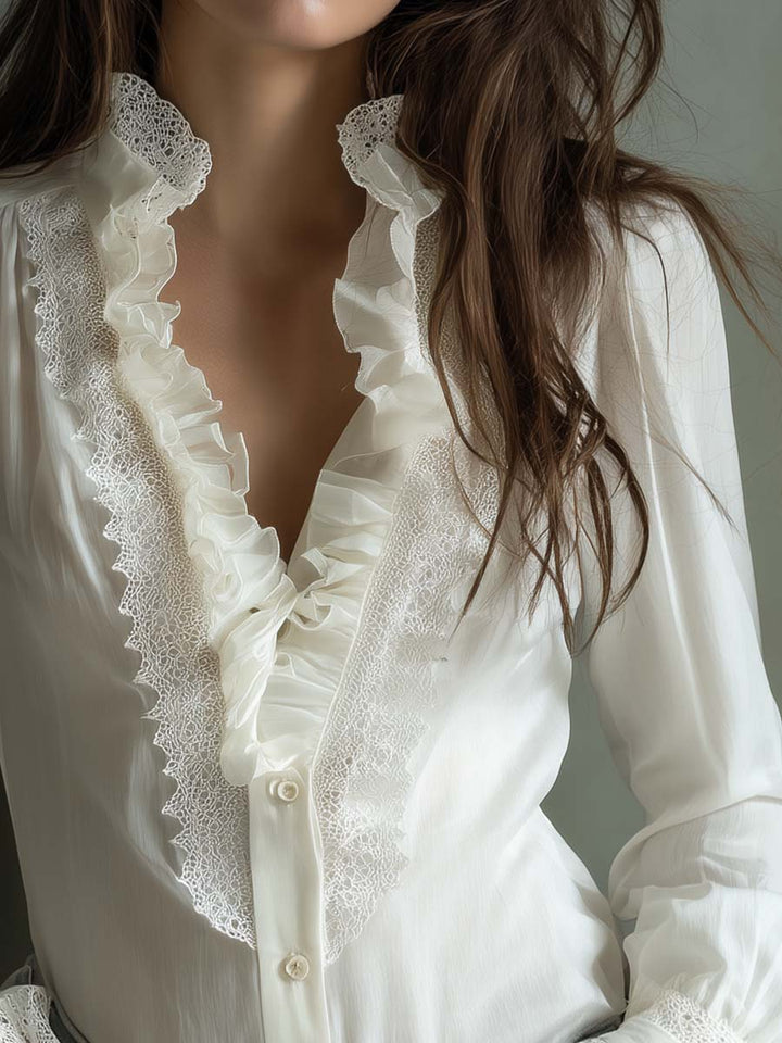 Ivory ruffled lace blouse detail view