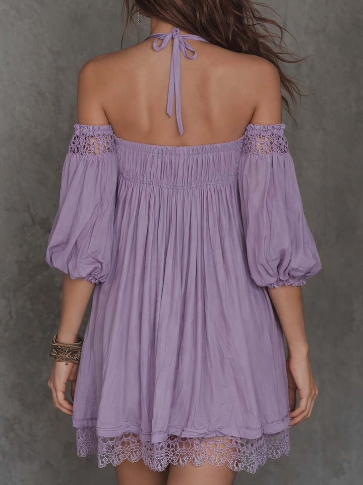 Off-shoulder embroidered mini dress detail close-up