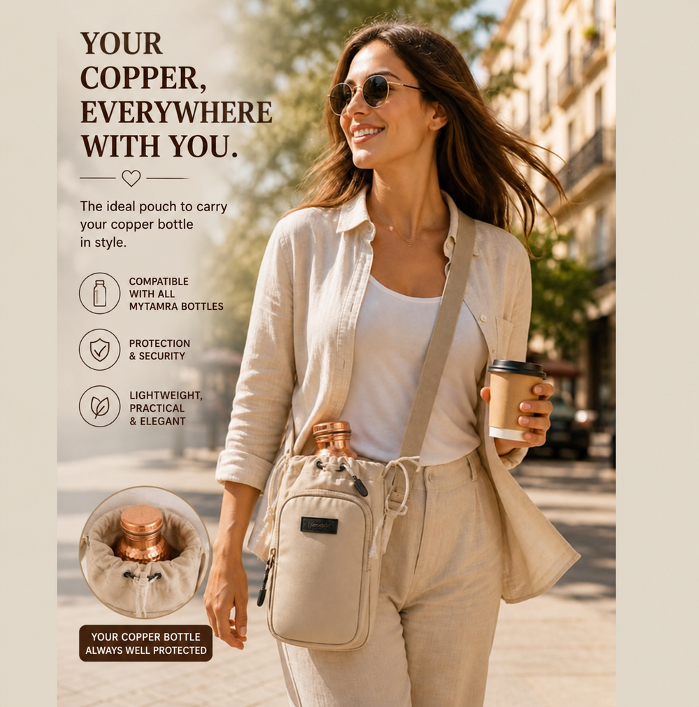 Woman walking outdoors wearing the beige copper bottle carrier bag, holding a coffee cup