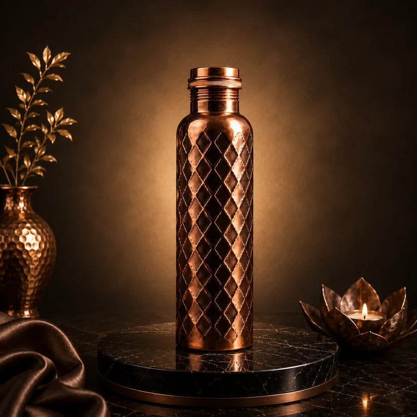 Diamond 100% pure copper water bottle on black marble stand with candle and copper vase, moody styling