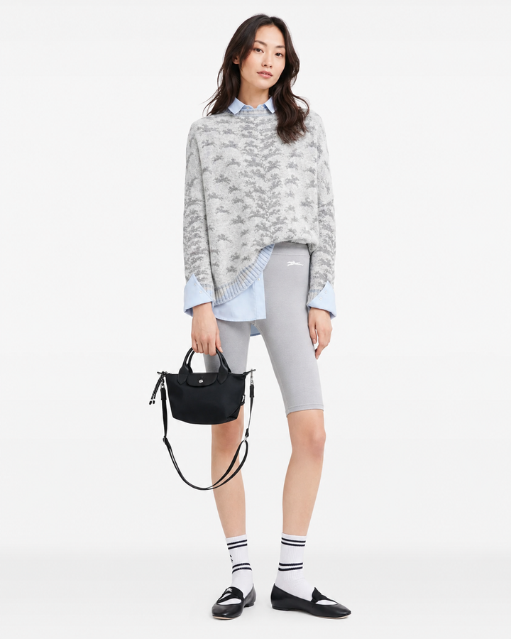 Longchamp Le Pliage Energy XS Black Handbag side view with silver hardware and cowhide leather trim