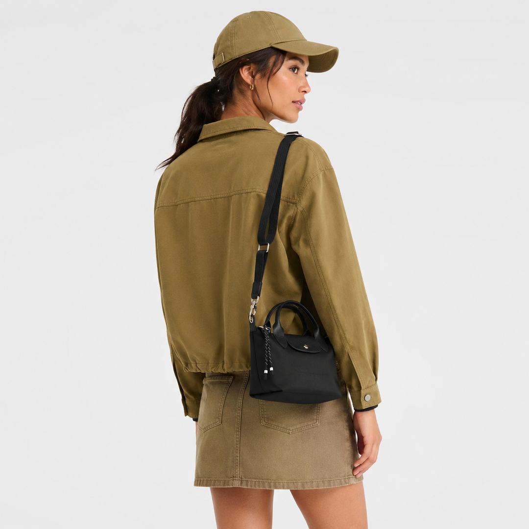 Longchamp Le Pliage Energy XS Black Handbag lifestyle shot worn as evening crossbody bag