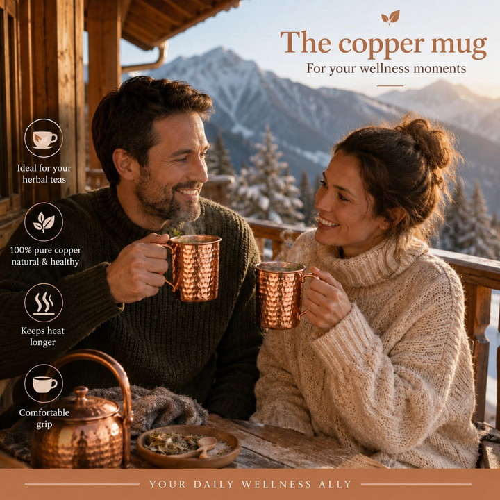 Hammered copper mug styled next to a copper water bottle in a lifestyle setting