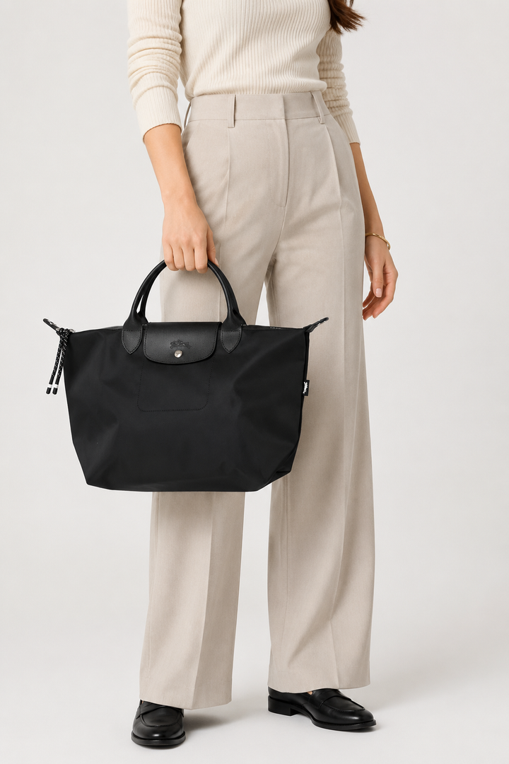 Longchamp Le Pliage Energy Small Black Crossbody Bag worn crossbody with adjustable removable strap