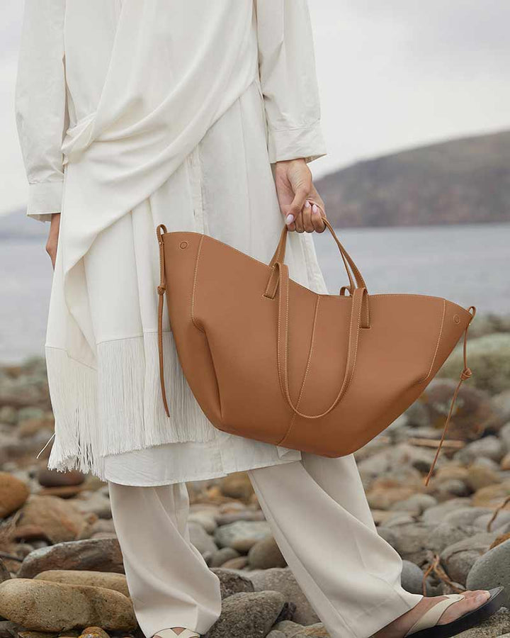 Cyme luxury camel leather handbag top handle detail