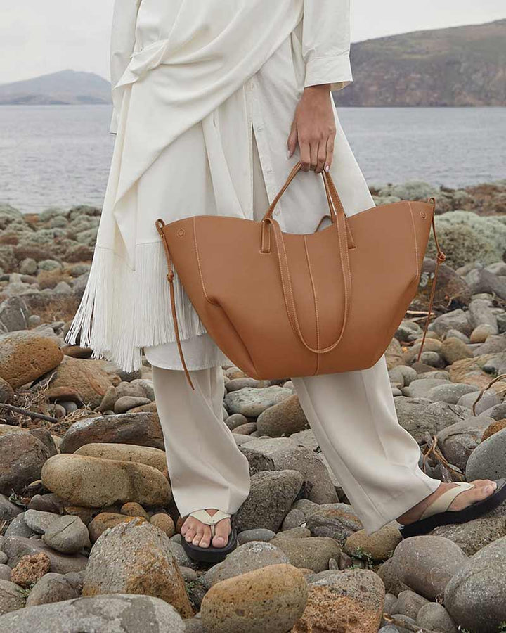 Cyme camel leather tote bag three-quarter view designer