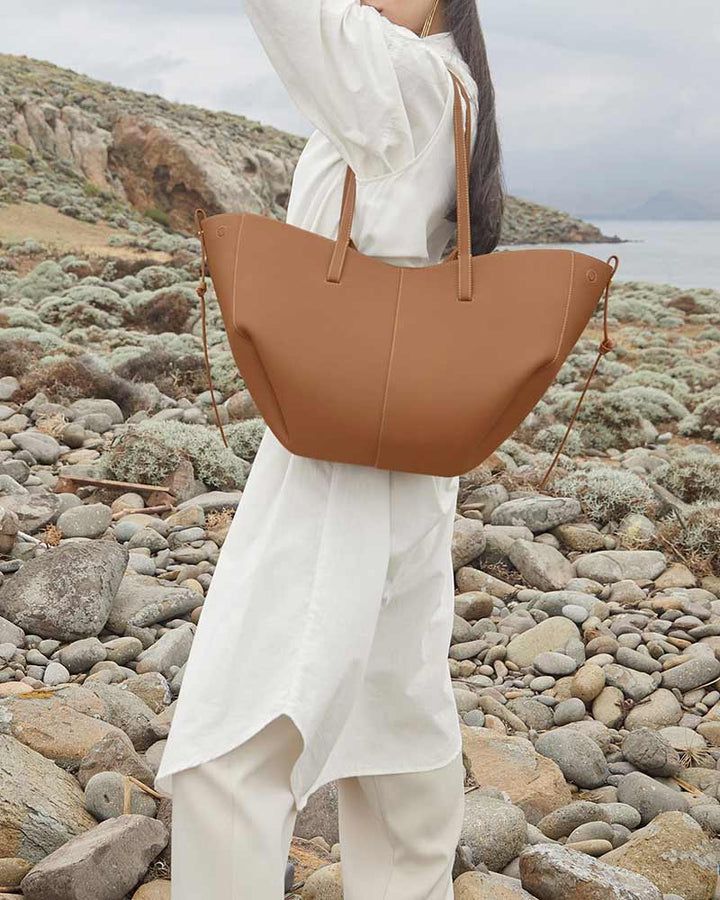 Cyme camel leather tote bag back view wave fold silhouette