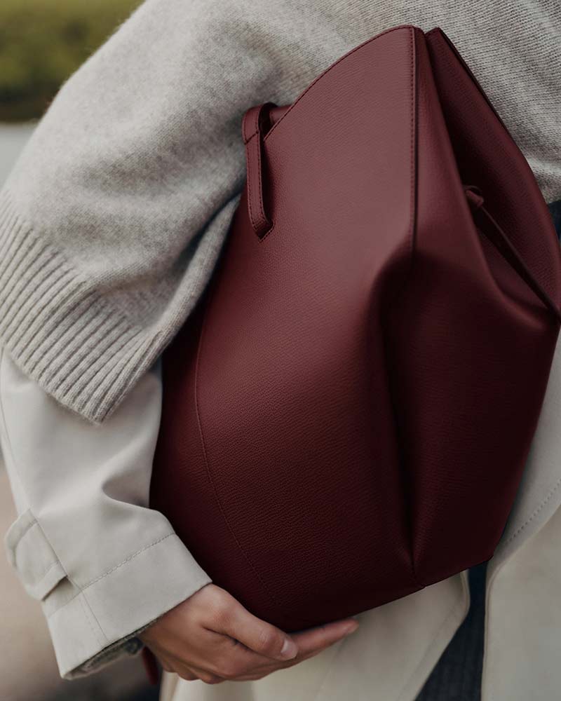 Cyme textured leather handbag black cherry side profile women