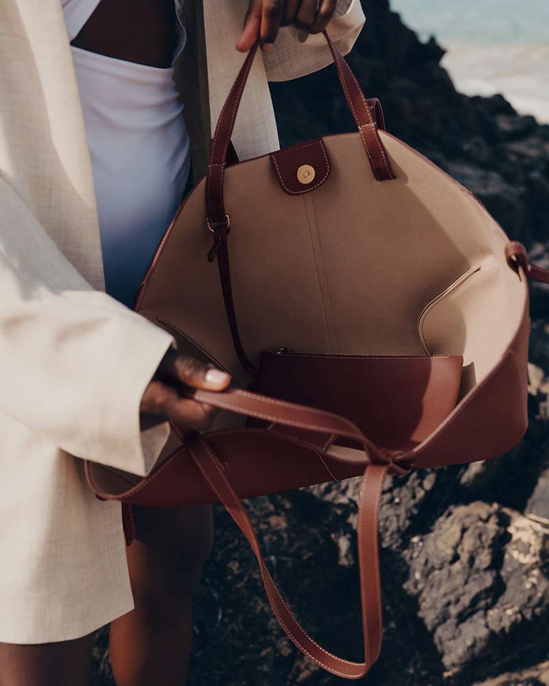 Cyme textured leather handbag cognac side profile luxury