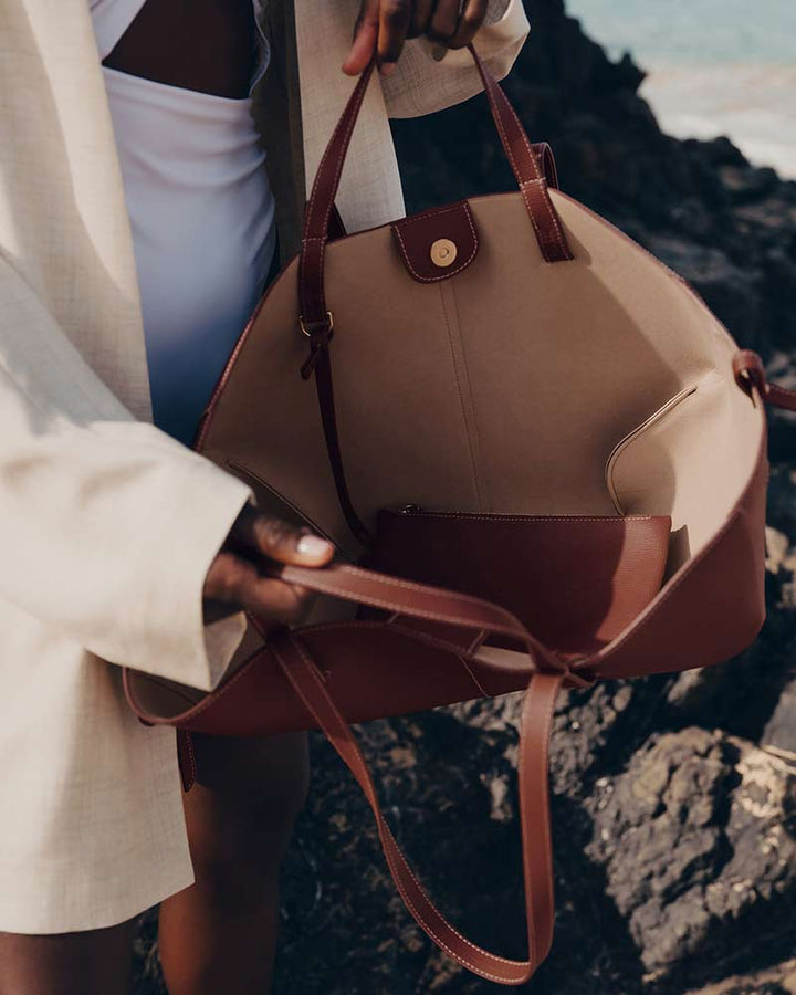 Cyme textured leather handbag cognac side profile luxury