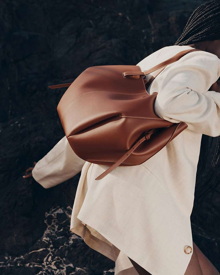 Cyme leather bag cognac wave fold silhouette back view