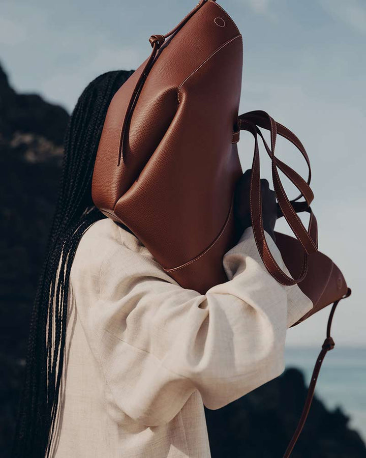 Cyme cognac designer tote bag lifestyle model shot