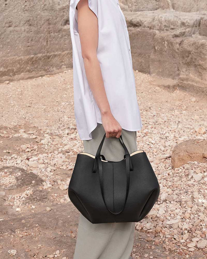 Cyme designer leather tote bag black flat lay product shot