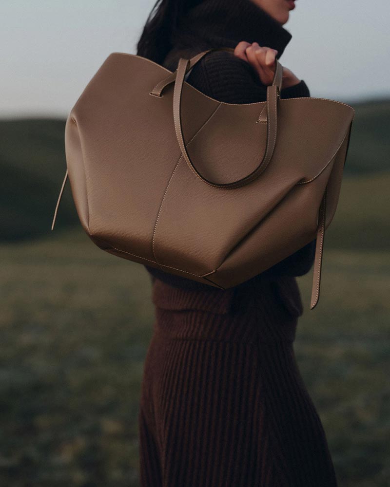 Cyme structured leather tote black worn body angle model