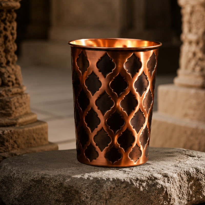 99.9% pure solid copper Diamond glass tumbler, studio product photo on a plain background.