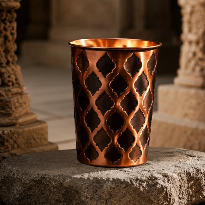 99.9% pure solid copper Diamond glass tumbler, studio product photo on a plain background.