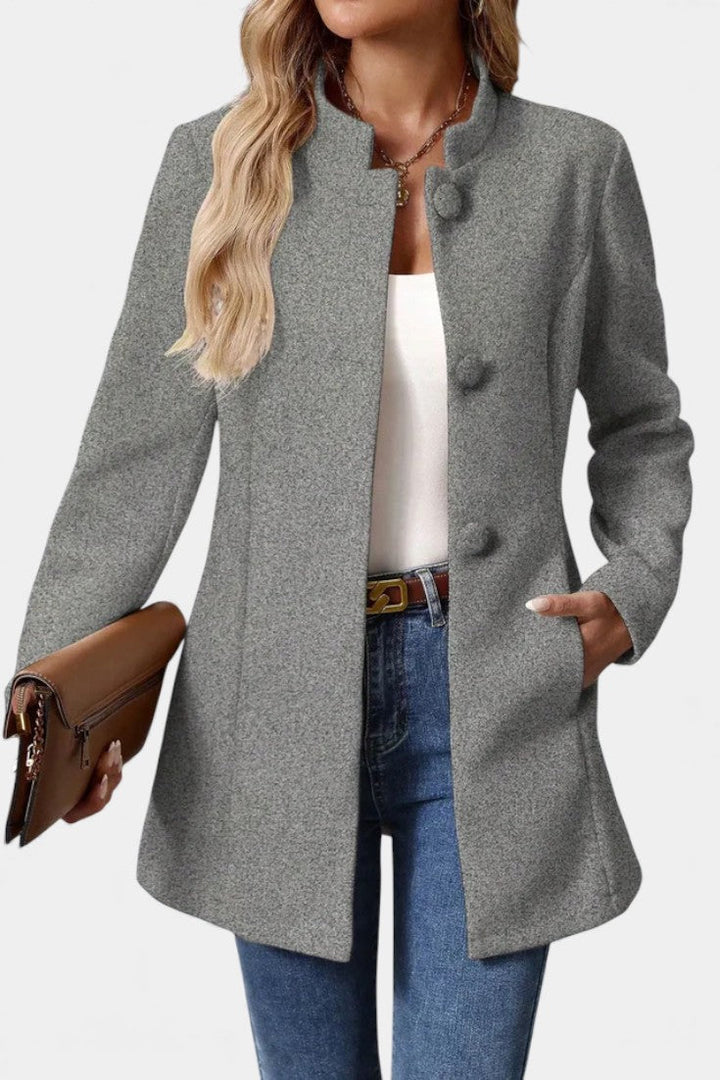 Lyana long sleeve coat model sitting pose