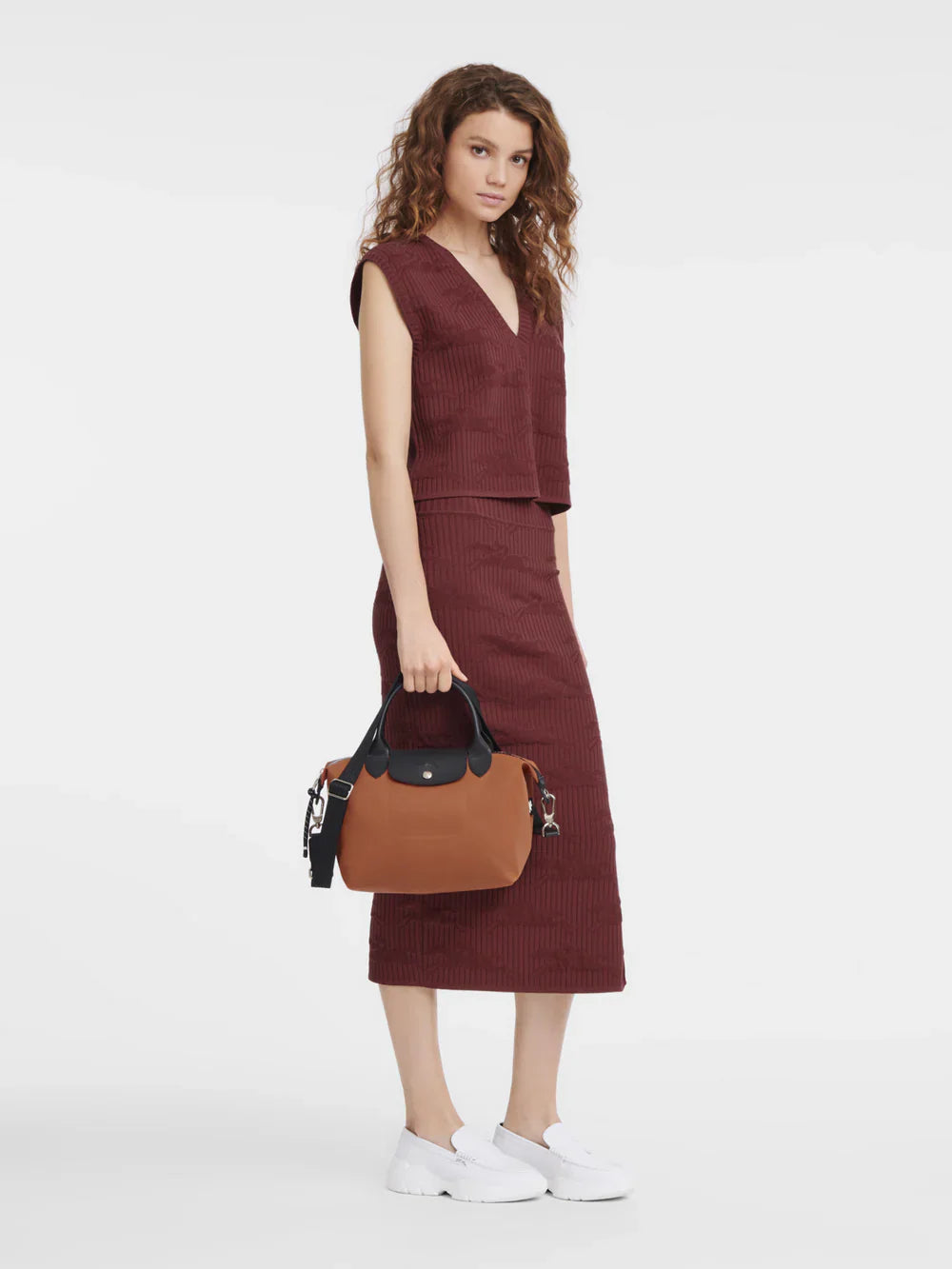 Longchamp Le Pliage Energy Small Sienna Crossbody Bag on model worn as shoulder bag sienna orange colour